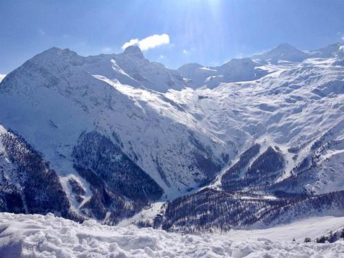 a mountain covered in snow with mountains in the background at Apartment Mikado by Interhome in Saas-Fee