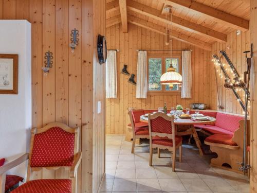 a dining room with a table and chairs at Apartment Roossihuus Apt-S by Interhome in Wengen