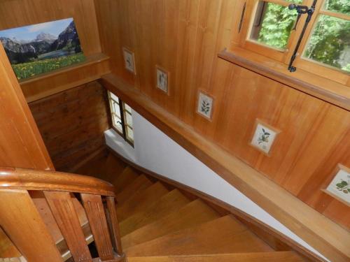 an image of a staircase in a tiny house at Apartment Tree-Tops- Chalet by Interhome in Gstaad
