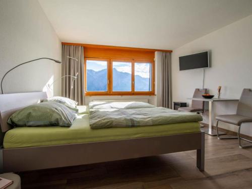 Ένα ή περισσότερα κρεβάτια σε δωμάτιο στο Apartment Zurschmitten 0 1- UG Süd by Interhome