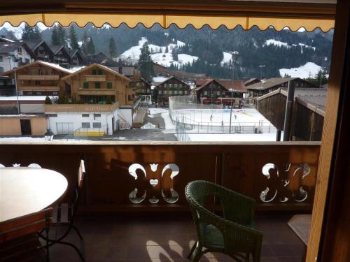 a window with a view of a ski resort at Apartment Drive - Nr- 3 by Interhome in Gstaad