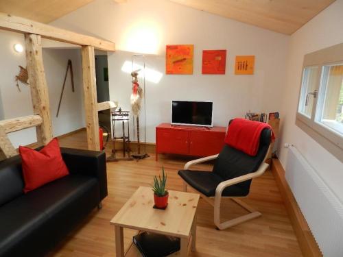 TV a/nebo společenská místnost v ubytování Apartment Simme-Tröimli by Interhome