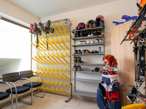 a walk in closet with a wall of shoes at Apartment Zurschmitten 15 1- UG Süd by Interhome in Riederalp