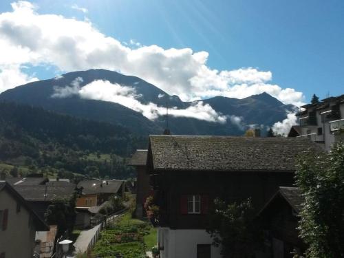 a view of a mountain from a town with houses at Apartment ABC Ferienwohnung 3 1- OG Nord-Ost by Interhome in Fiesch