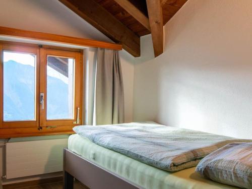 Katil atau katil-katil dalam bilik di Apartment Zurschmitten 17 1- OG Süd by Interhome