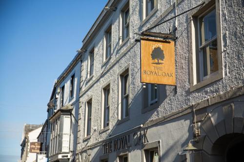 a building with a sign on the front of it at Royal Oak at Keswick in Keswick
