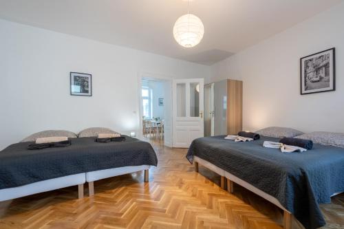 a bedroom with two beds in a room at revLIVING Apartments Eggenburg in Eggenburg