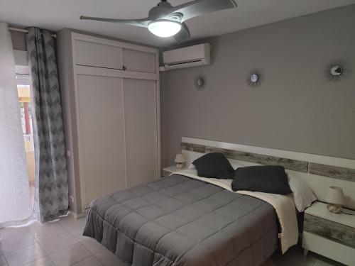 A bed or beds in a room at New Style Iris