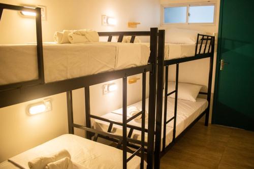 Postel nebo postele na pokoji v ubytování Grand'Hostel