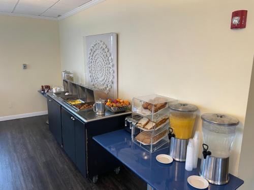 a kitchen with a counter with a buffet with food at Lakeside Inn in Wakefield