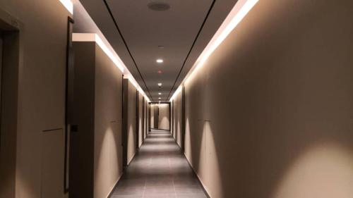 a hallway with a row of lights on the walls at BORNEO SUTERA BAY Homestay Services in Kota Kinabalu