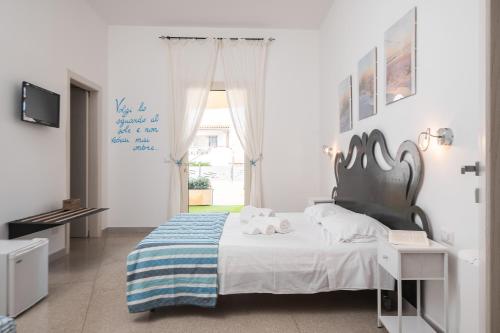 Preferisco b&b e trattoria sul mareにあるベッド