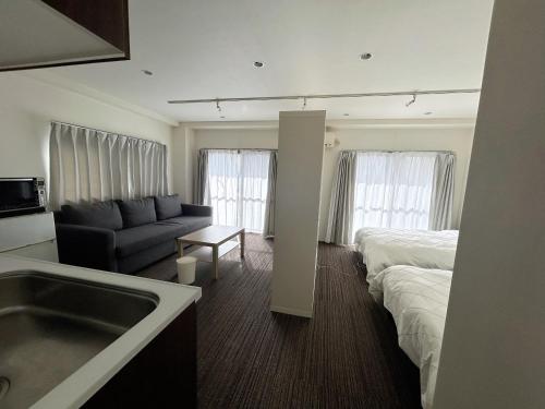 Postel nebo postele na pokoji v ubytování 山中ビル3Fーワンフロア貸切48平方メートルone floor private room
