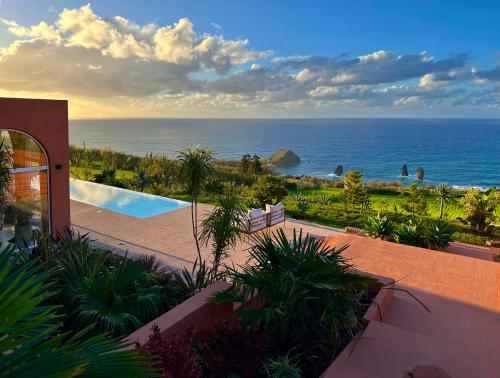 a view of the ocean from a house at Villa Anna Splendid Sunset Ocean Front in Mosteiros