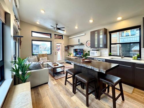 a kitchen and living room with a table and a couch at Cozy 2 Bedroom by Teton Pass in Victor