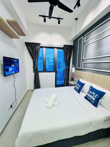 Ένα ή περισσότερα κρεβάτια σε δωμάτιο στο THE LUXE INFINITUM KLCC By KL MALAYSIA