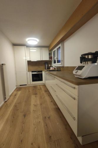 Kuchyň nebo kuchyňský kout v ubytování Apartment Lenk Unique by Interhome