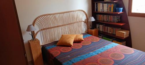 a bed with two pillows on it in a bedroom at Vautrain in Artignosc-sur-Verdon