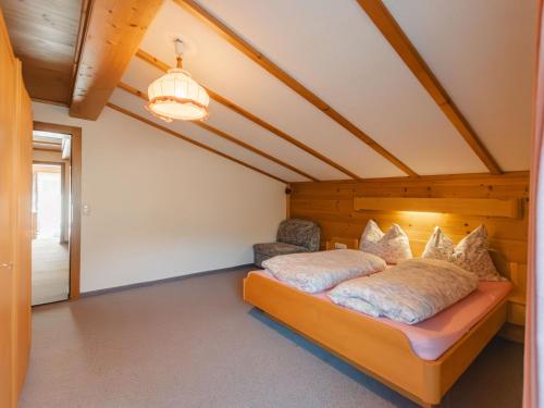 a bedroom with a bed in a attic at Apartment Wildkogel 1 by Interhome in Neukirchen am Großvenediger