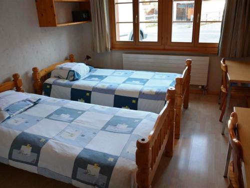 Postel nebo postele na pokoji v ubytování Apartment Jacqueline 11 by Interhome
