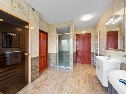 a bathroom with a sink and a toilet and a mirror at Holiday Home Jílové by Interhome in Jílové