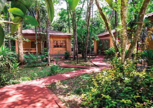 a house in the woods with a path leading to it at El Leñador by DOT Cabana in Puerto Iguazú