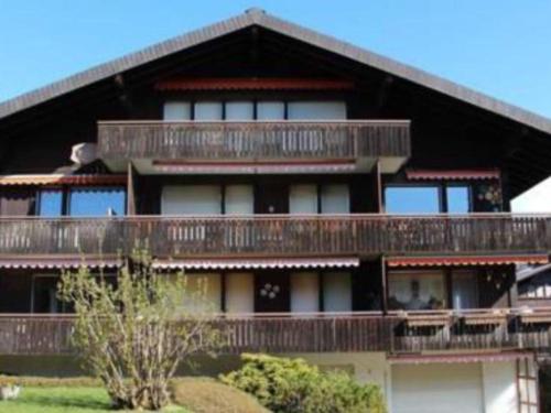 a large building with balconies on top of it at Apartment Morion by Interhome in Lenk