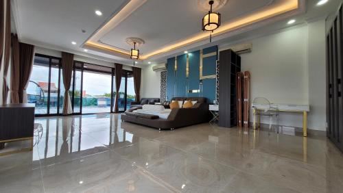 a living room with a couch and a table at Villa Homestay Thanh Hiền in Ho Tram