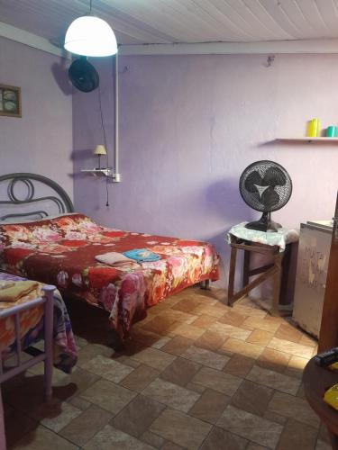 Ένα ή περισσότερα κρεβάτια σε δωμάτιο στο Hospedagem Chapéu Virado