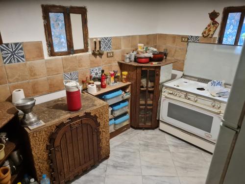 a kitchen with a stove and a stove top oven at Andyvone at yvone in Dahab