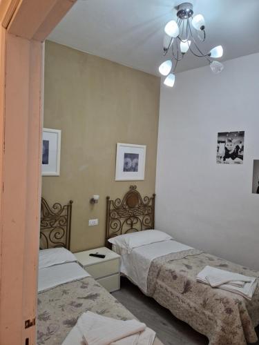 Кровать или кровати в номере Affittacamere Cecco Rooms