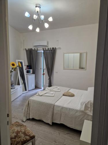 Кровать или кровати в номере Affittacamere Cecco Rooms