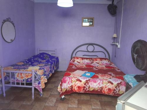 Ένα ή περισσότερα κρεβάτια σε δωμάτιο στο Hospedagem Chapéu Virado