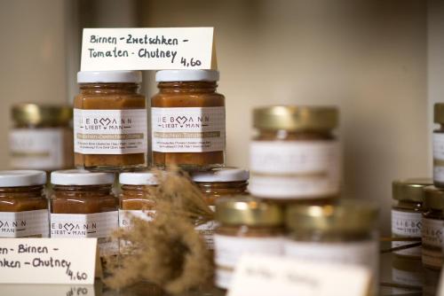 a group of jars of honey on a shelf at Hotel Liebmann in Lassnitzhöhe