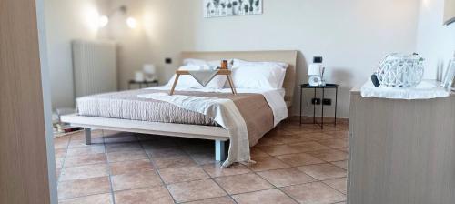 a bedroom with a bed with a blanket on it at Quick Home Mimosa in Alice Castello