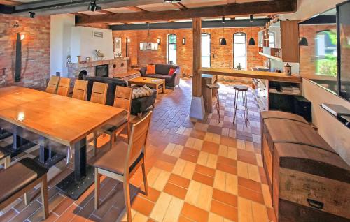 a living room with wooden tables and chairs at Ferienhaus Viereck in Viereck