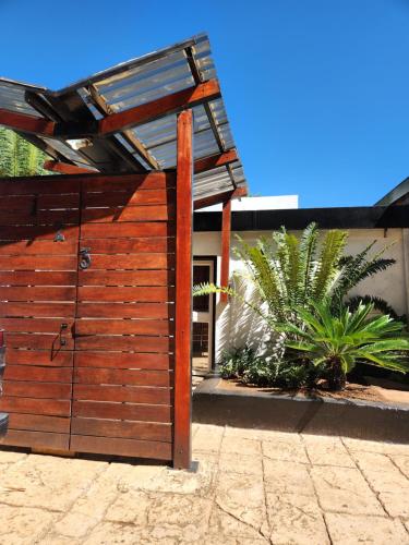 a wooden gate in front of a house at Le Bamboo Guest House And Boat Cruise in Hartbeespoort