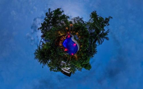 an overhead view of a merry go round at night at Sundaras Infinity Jungle Resort in Dambulla