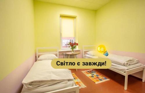 Una cama o camas en una habitación de P2B hostel & bar