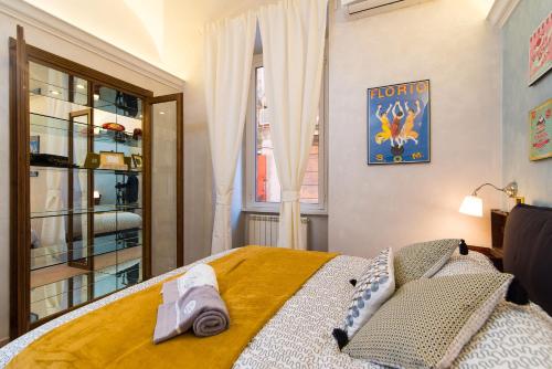 a bedroom with a bed and a window at B&B Arco Di Gallieno in Rome
