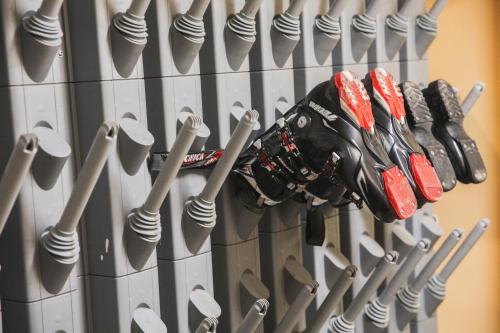 a display of baseball bats and a baseball glove at Hotel Diamant Park in Campitello di Fassa
