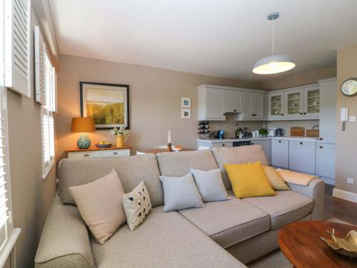 a living room with a couch and a kitchen at 28 Long Quay in Cork
