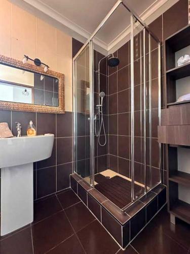 a bathroom with a shower and a sink at Casa Valhalla in Funchal