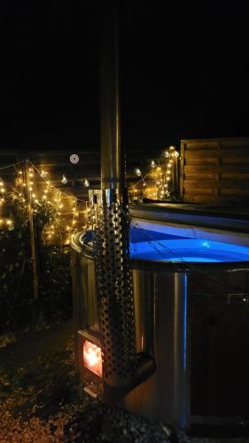 a view of a building with christmas lights at night at Romantischer POD - Gegen Aufpreis mit Hot Tub - Whirlpool & Sauna in Hohenberg an der Eger