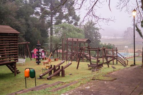 a park with a bunch of playground equipment at Hotel Villa Michelon in Bento Gonçalves