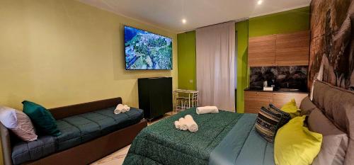a living room with two beds and a couch at Il Magnifico Superior Rooms 400m from Tiburtina Railway Station and 290m from Metro in Rome
