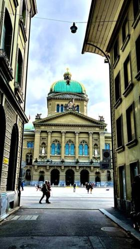 a large building with a green dome on top of it at Hidden Retreats The GreenAlley in Bern