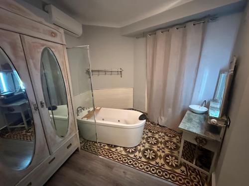 a bathroom with a bath tub and a shower at Puerta de Alcaraz in Alcaraz