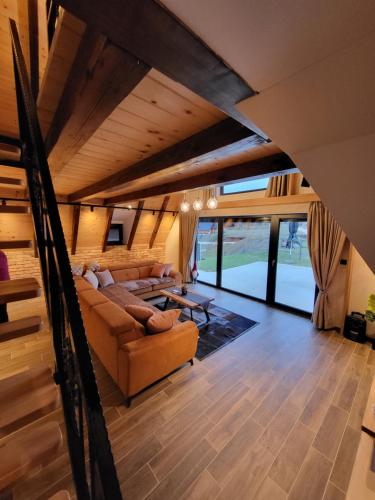 a living room with a couch and a table at Jahorina Green Chalet in Pale