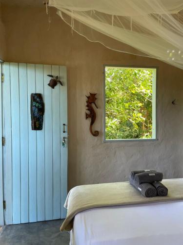 Katil atau katil-katil dalam bilik di Eco Hostel Bosque di Barro